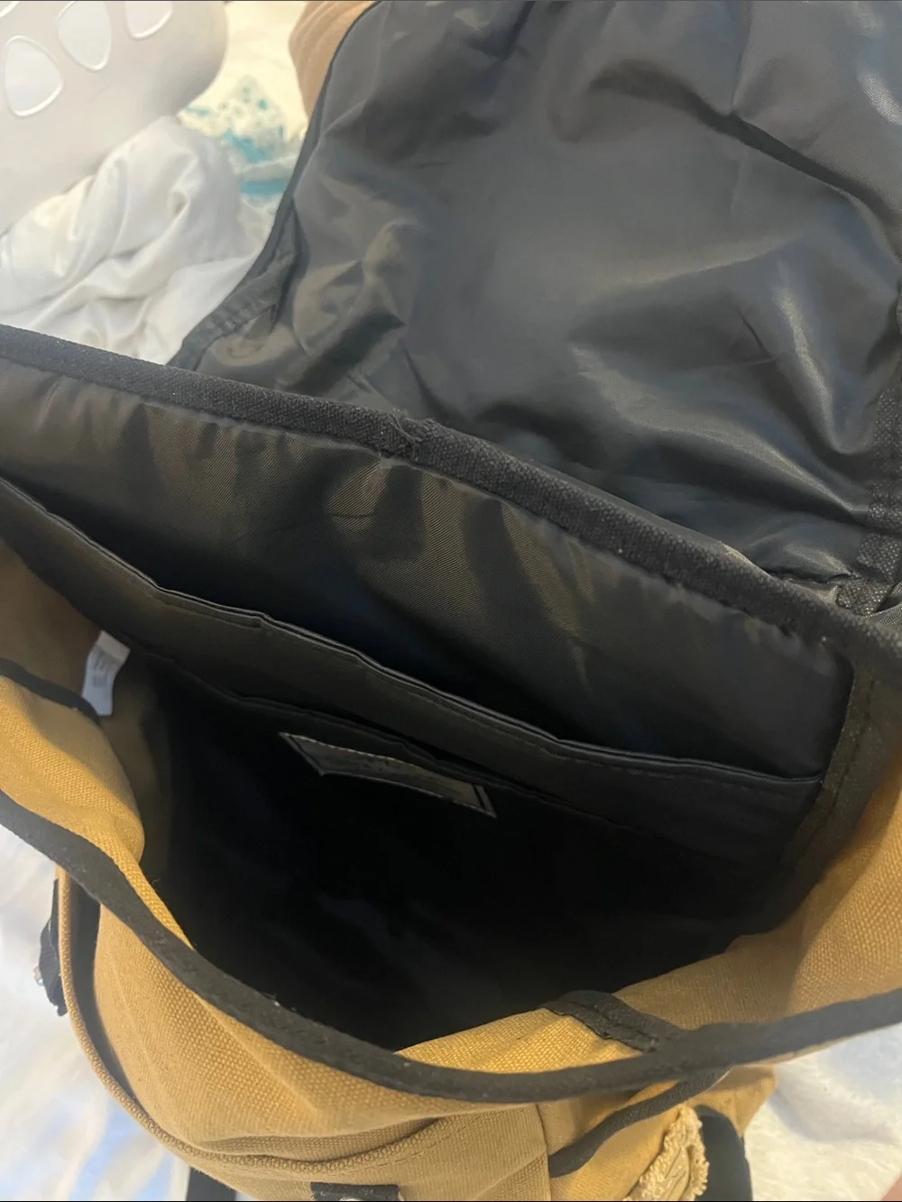 Tan Canvas Backpack with Black Trim